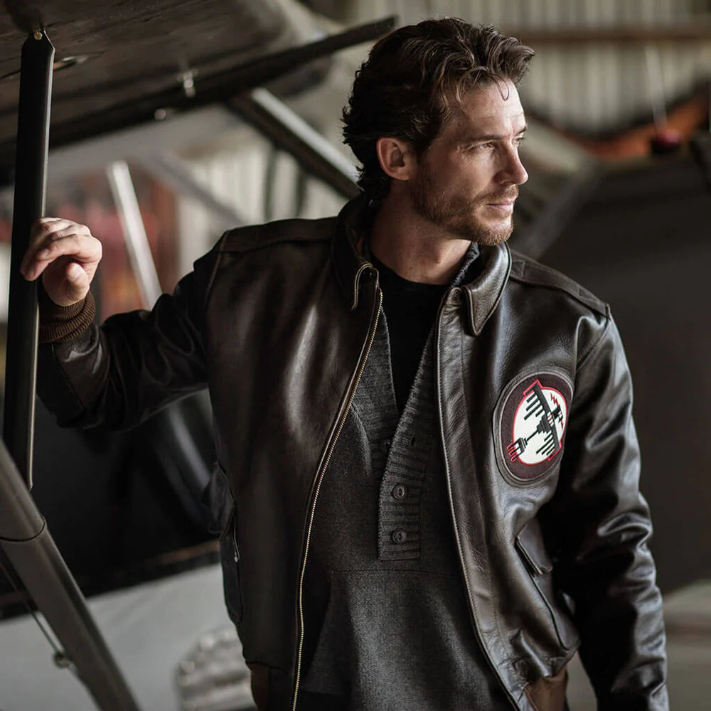 Man wearing a jacket with a patch in an indoor setting