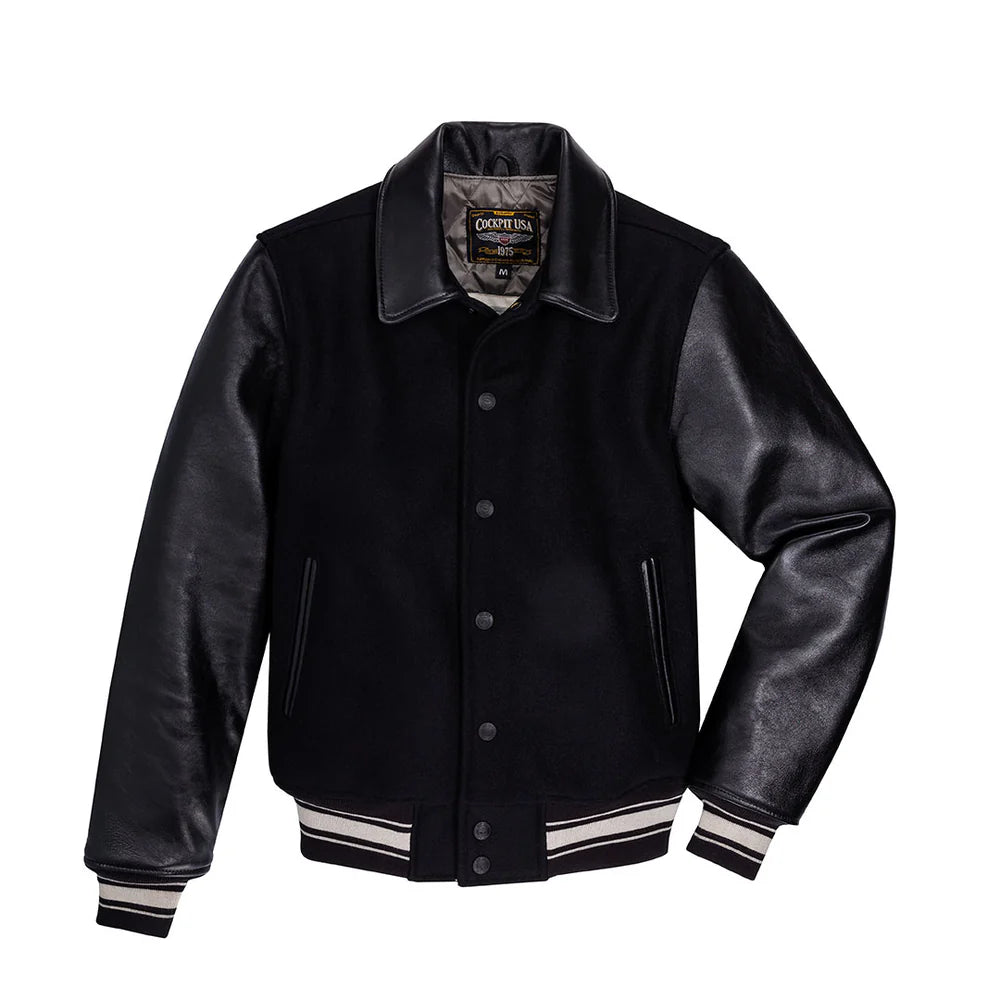 Black varsity jacket with leather sleeves on a white background