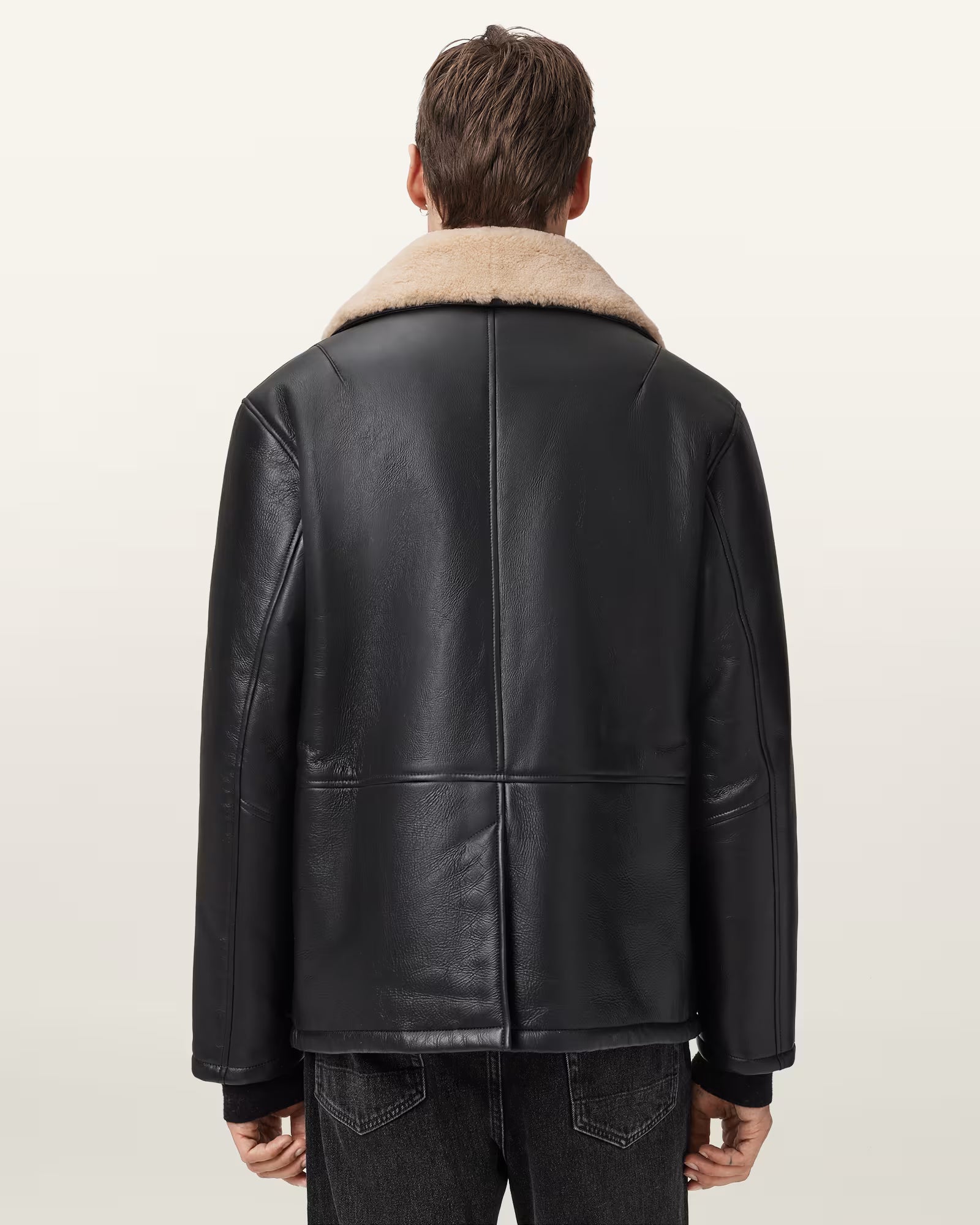 Back view of Deunia shearling coat – semi-shine finish and classic silhouette