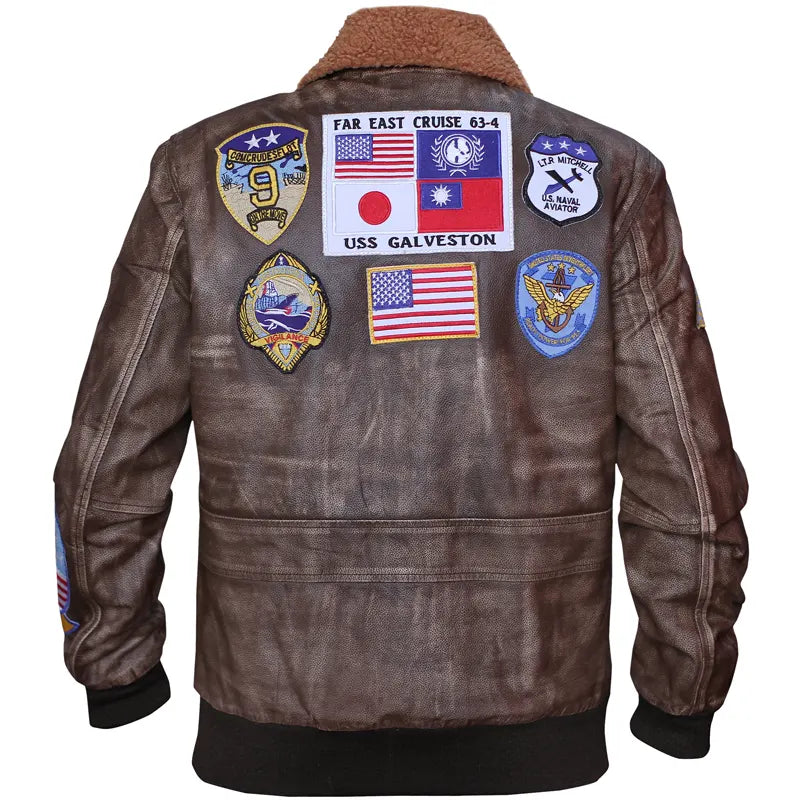 Brown leather jacket with various patches on a white background