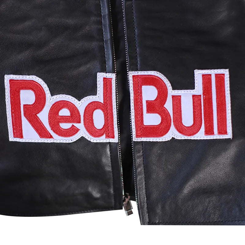 Black leather jacket with Red Bull logo patches on a dark background