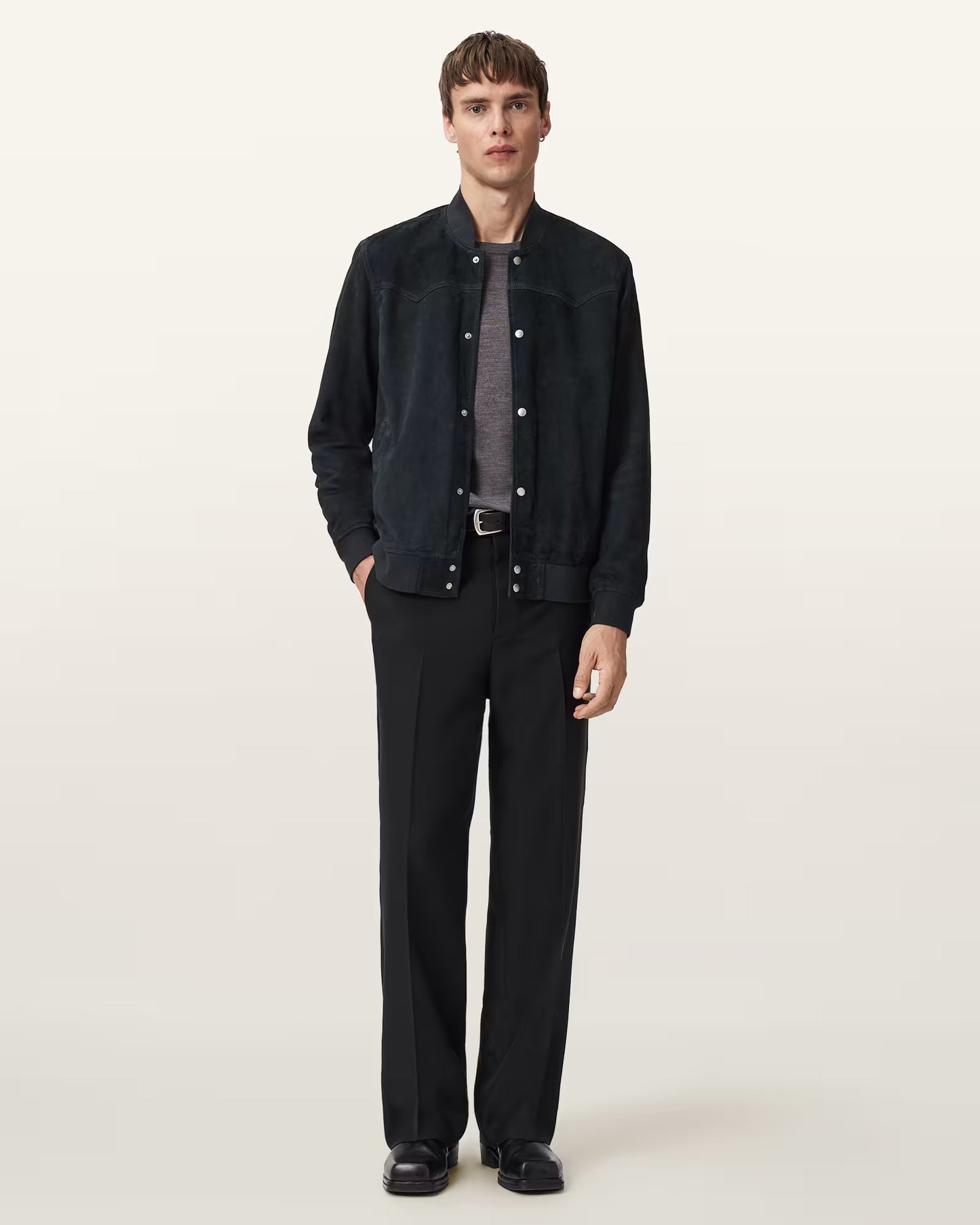 "Close-up of Stafford suede bomber jacket with ribbed cuffs and zip closure"