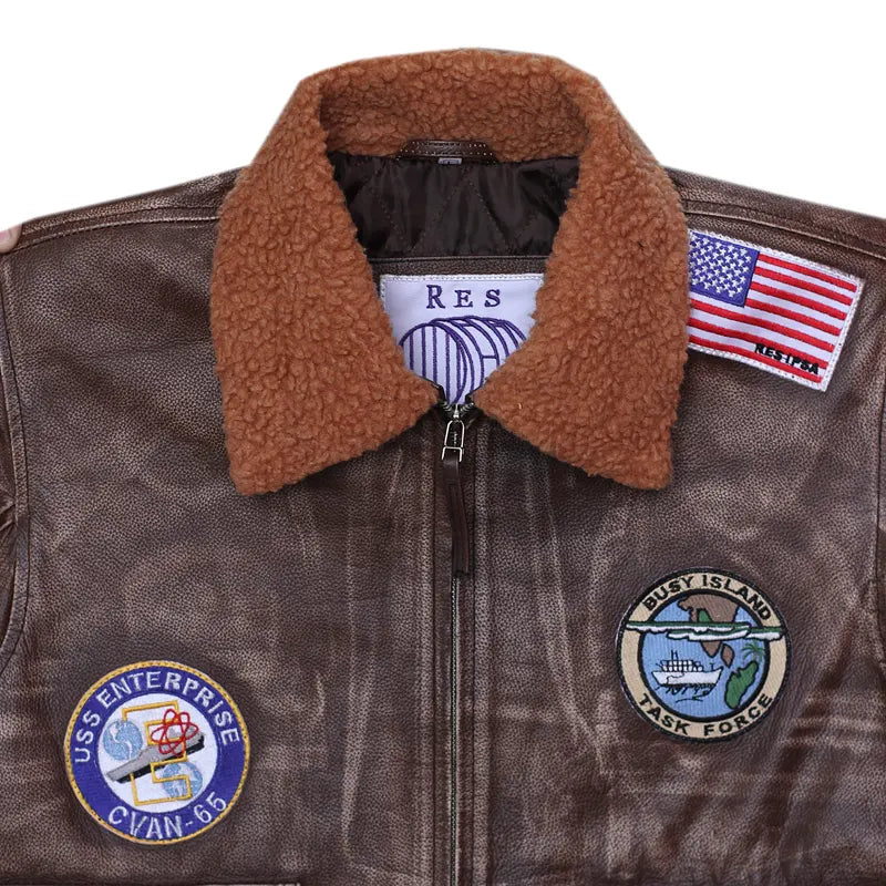 Brown leather jacket with patches and an American flag patch on a white background