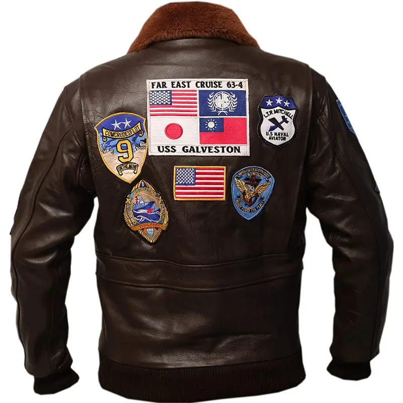 Brown leather jacket with various patches on a white background
