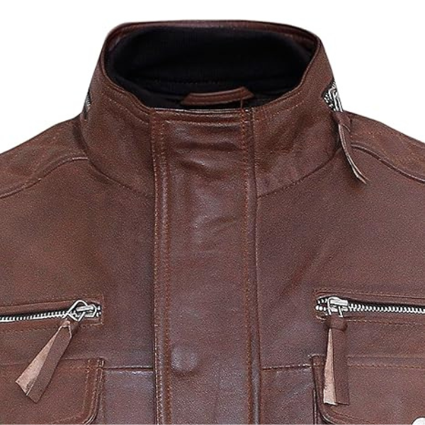 Close-up of a brown leather jacket with zippers on a white background