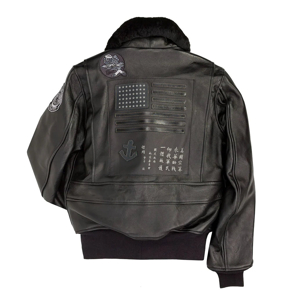 Black leather jacket with patches on a white background