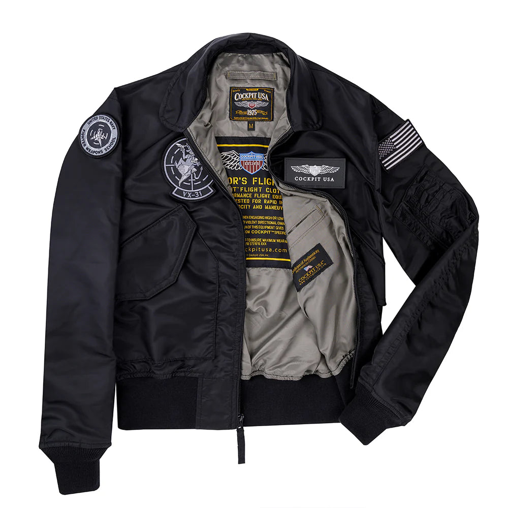 Black leather jacket with patches and fur lining on a white background