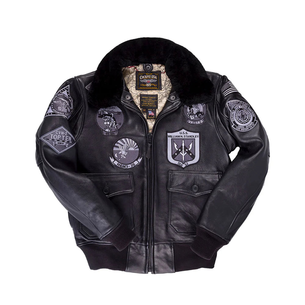 Black leather jacket with various patches on a white background