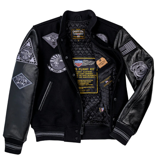 Black leather jacket with various patches and branding on a white background