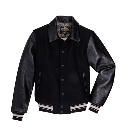 Black varsity jacket with leather sleeves on a white background